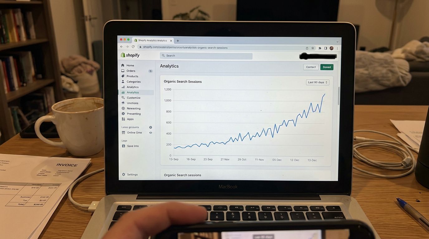 SCENE: Close-up of a Shopify analytics screen showing organic search traffic line sharply climbing over a 90-day period